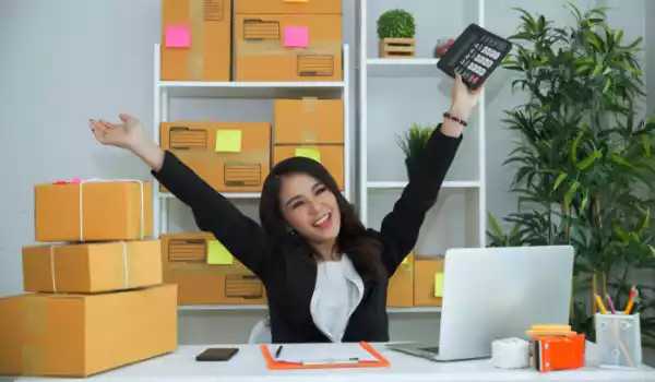 Happy woman using a feature in solar CRM software.
