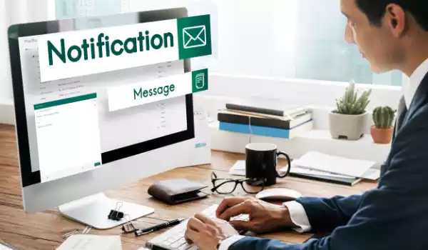 Man checking notifications in solar CRM software.